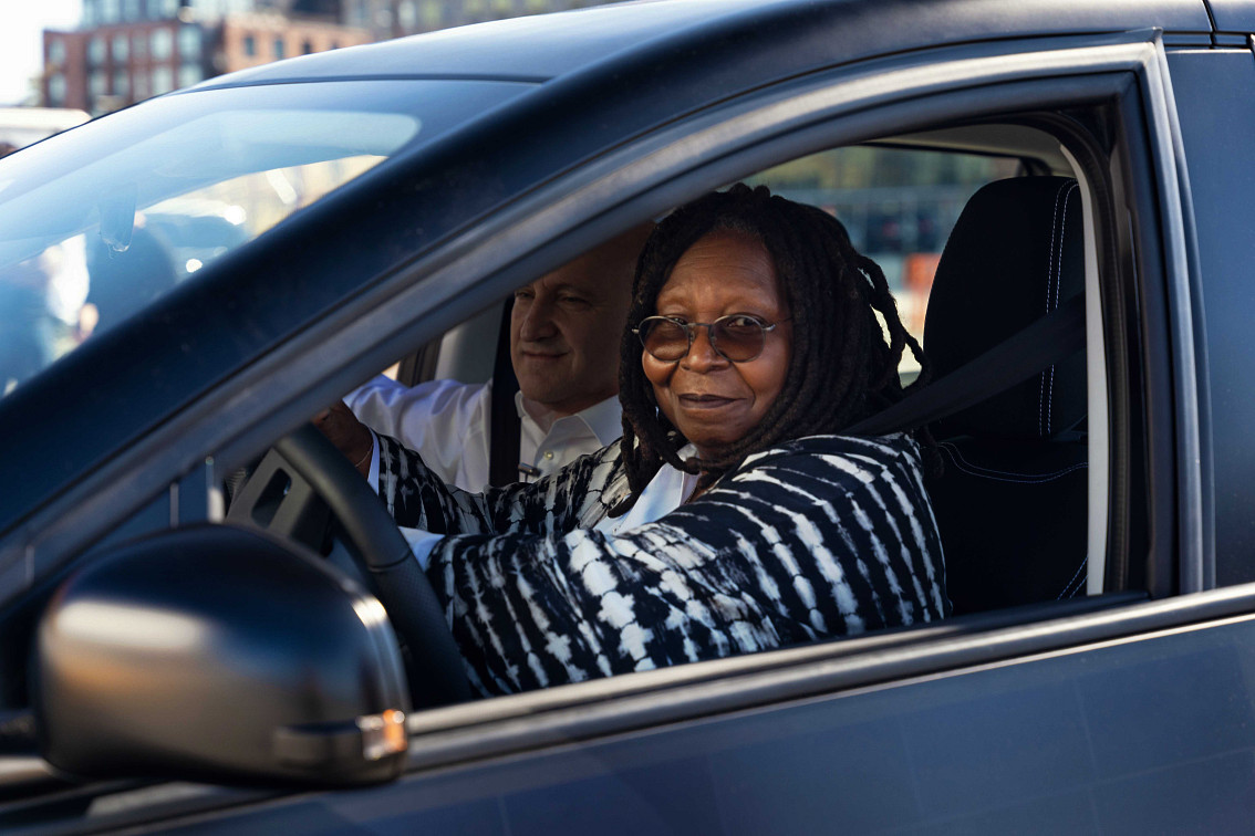 Whoopi driving the Sion together with our COO Thomas.